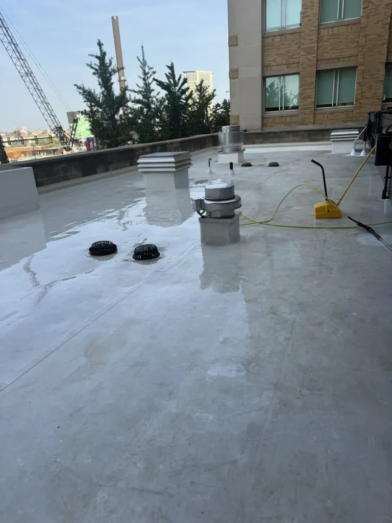 TPO roof with curbs, drains, and wall flashing